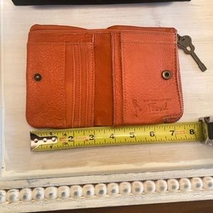 Fossil Wallet Orange with Key Charm.  Well used, soft leather, issue on back!!